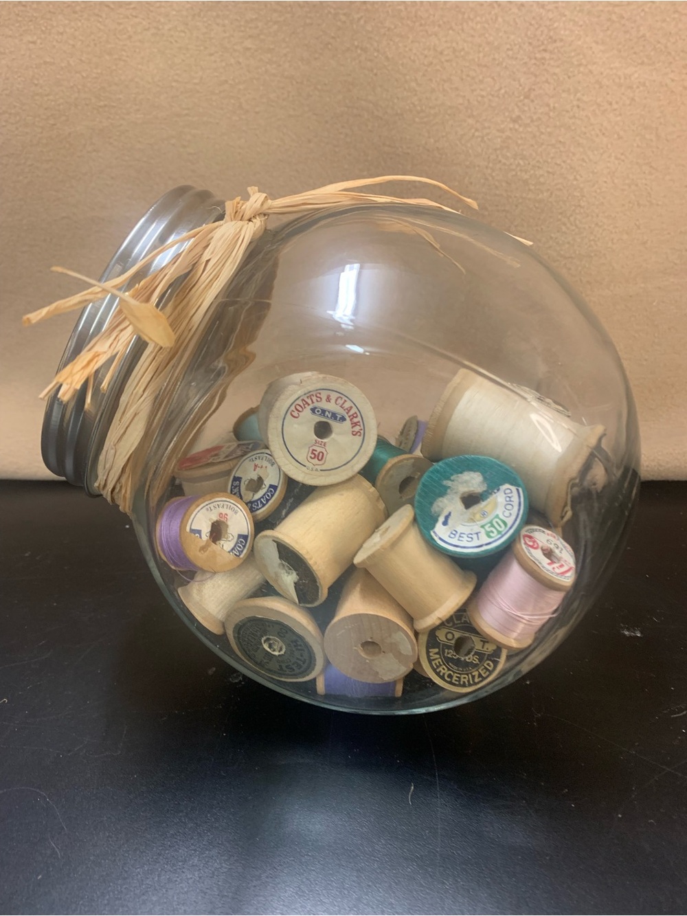 Glass Jar of Vintage Wooden Spools with Assorted Thread